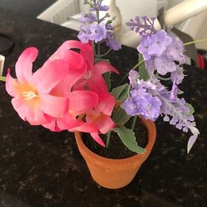 Small pot with fake flowers for decoration